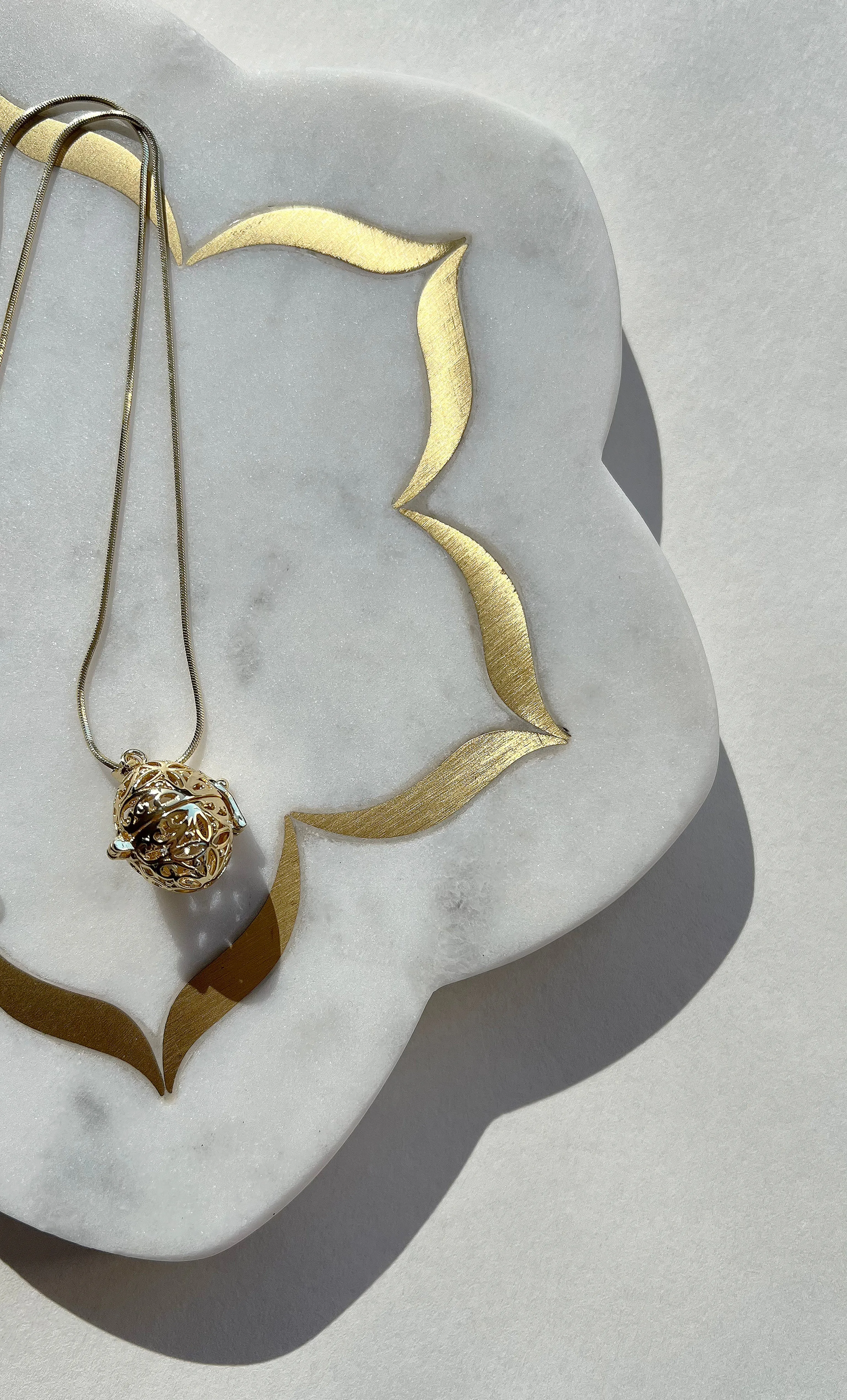 The Tunik Cage Locket Pendant Necklace